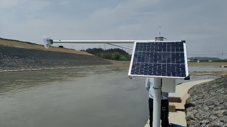Solar-powered CCTV bracket system mounted by a river