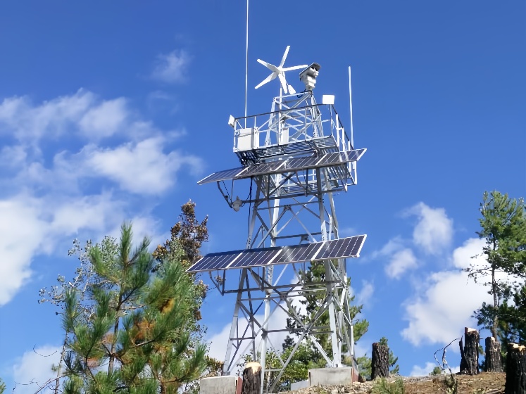hybrid wind-solar CCTV surveillance tower deployed in forest for wildfire early warning and long-distance video transmission