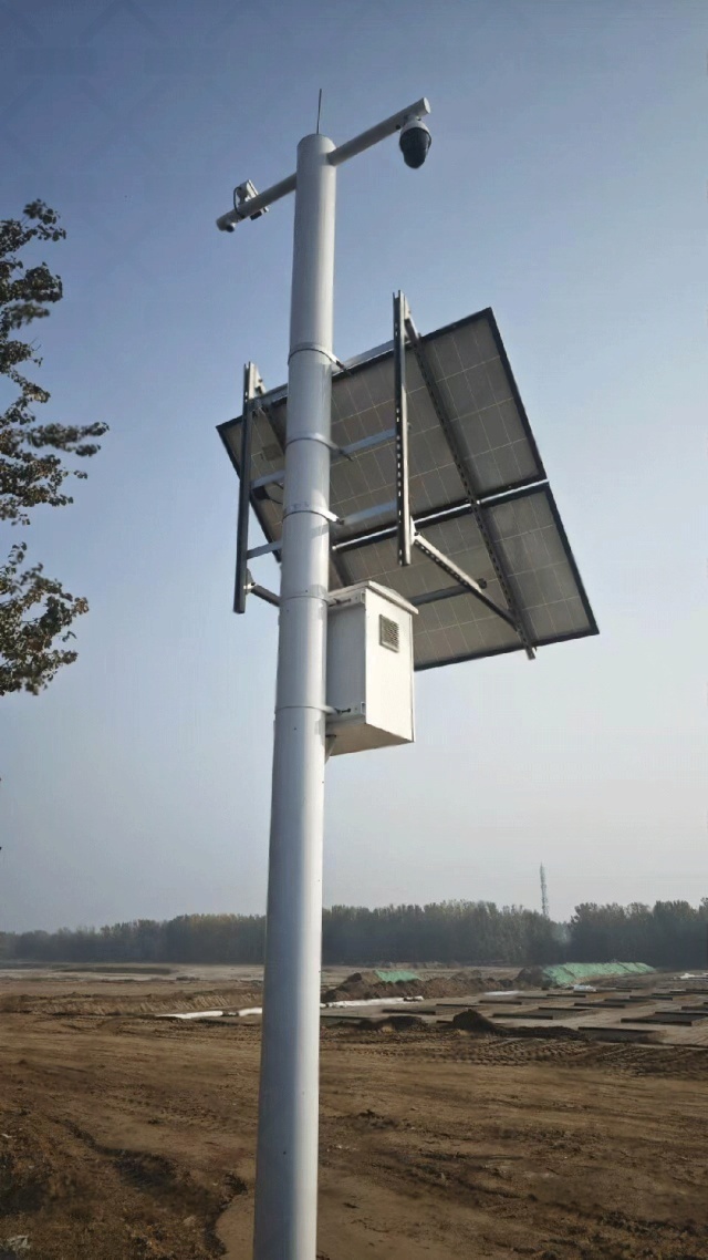 A high-angle view of a dual-panel solar monitoring system used in Shijiazhuang for water-management applications, showing the elevated array, camera equipment, and reinforced installation structure