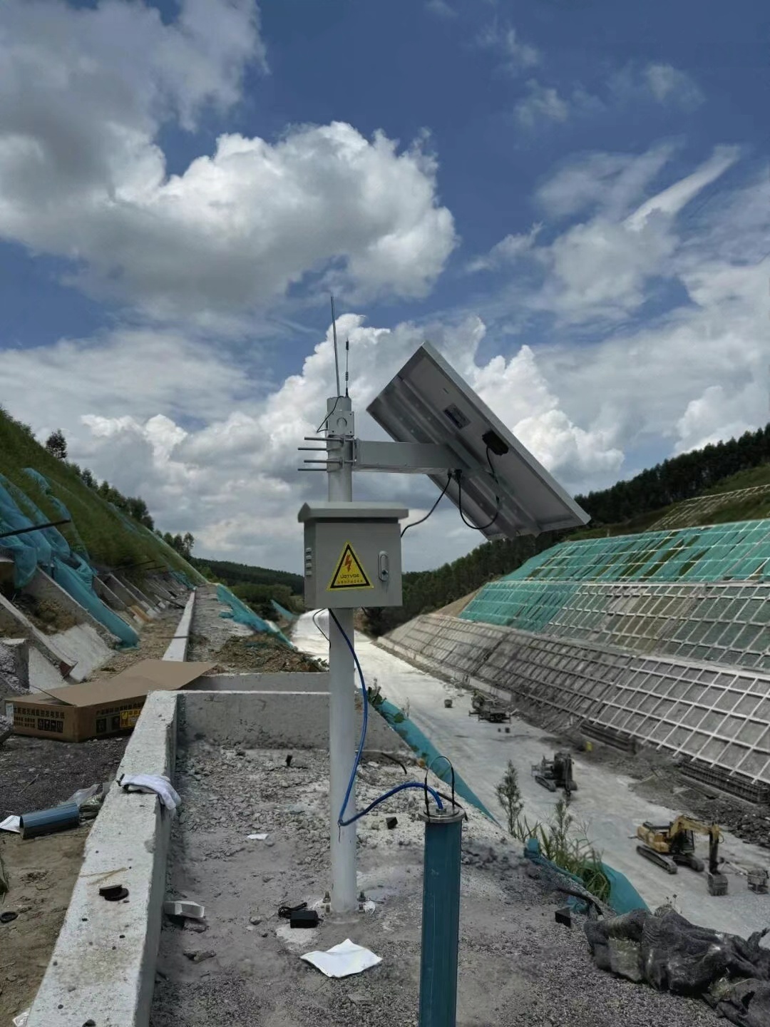 A pole-mounted solar power system supplies continuous electricity to slope deformation monitoring equipment in a mountainous construction zone in Nanning, Guangxi, China. The structure includes a monocrystalline solar panel, waterproof electronics enclosure, and wireless connectivity, enabling 24/7 geotechnical data acquisition without city grid access. This renewable configuration prevents downtime during heavy rain seasons and supports 3-day autonomy with a LiFePO4 battery. The installation reduces trenching risks, protects hillside ecology, and improves emergency warning capability for infrastructure safety. What is this solar solution used for? It powers remote slope-security instruments where grid access is unreliable