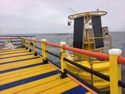 An off-grid solar power system structurally integrated on a marine monitoring buoy in Dalian, designed to withstand salt spray and offshore motion