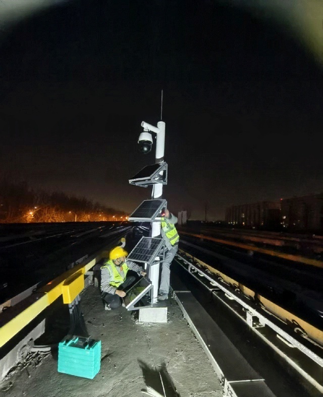 Off-grid solar power system installed along metro tracks in Beijing supporting continuous night-time surveillance and trackside monitoring under dust-prone and no-grid conditions