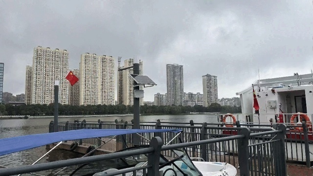 Solar-powered communication base station operating in an urban waterside park, designed for high humidity exposure and public-access environments