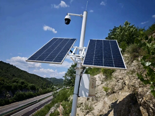 Off-grid solar power system for mountain road CCTV monitoring installed in Shijiazhuang, Hebei, showing sealed enclosure, dual PV modules, and camera integration under high-humidity conditions