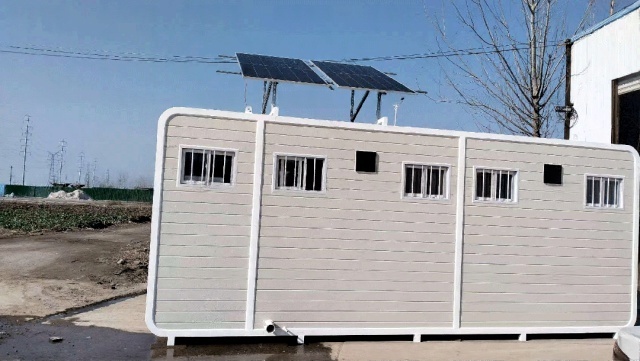 Single mobile sanitation unit operating with an off-grid solar power supply system, supporting continuous flushing and lighting under humid outdoor conditions in Anhui, China