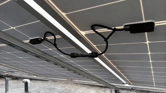 This PV cable-and-connector detail confirms that in Qingyang’s dust-prone, cold-exposed off-grid homes, connection integrity and serviceable cable routing are first-order reliability constraints because most long-term outages originate from field wiring degradation rather than panel wattage