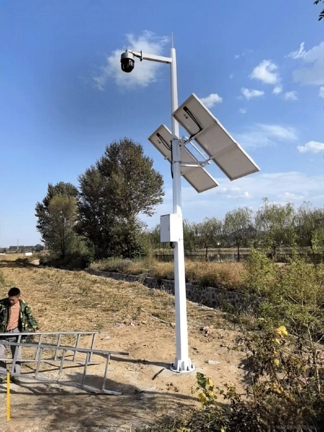 pole-mounted solar surveillance system in Zhangjiakou Hebei China confirms that storage-first off-grid solar architecture maintains continuous wilderness monitoring infrastructure operation under low-temperature exposure, windblown dust conditions, and grid-absent field deployment constraints