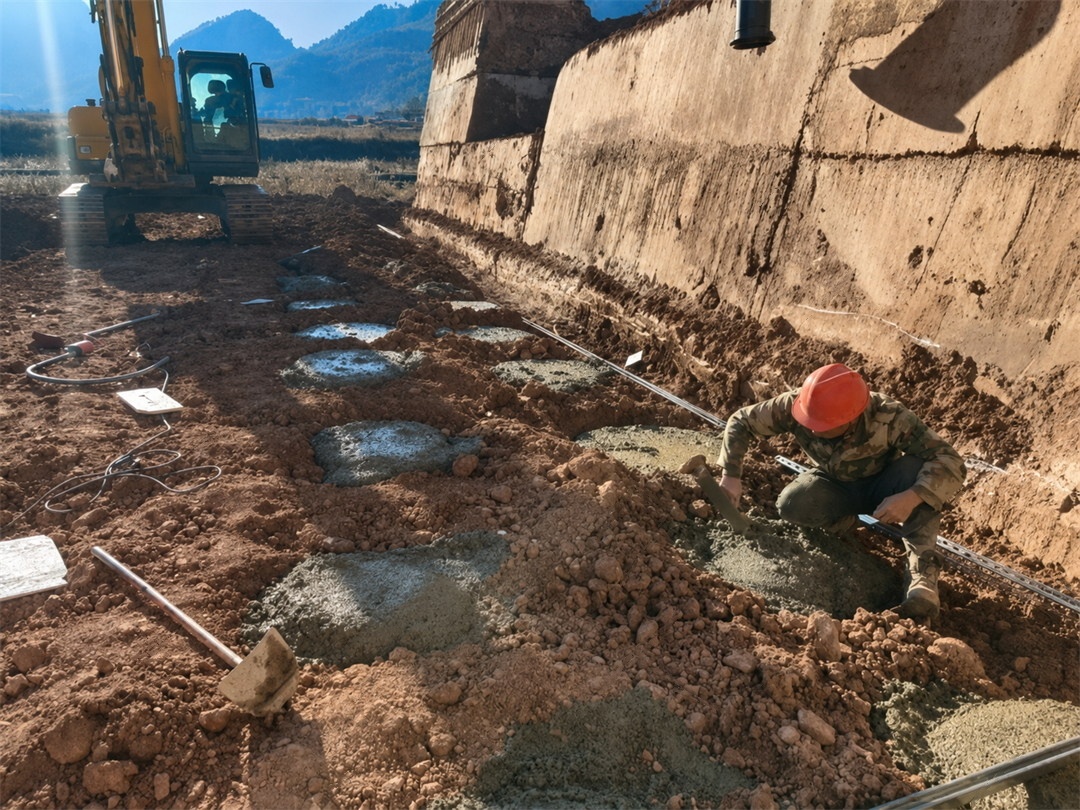 foundation construction for mountain wastewater pumping station solar energy system in Nujiang Yunnan China demonstrates that terrain-adapted civil preparation supports reliable off-grid power infrastructure under rainfall, soil settlement risk, slope conditions, and difficult maintenance access