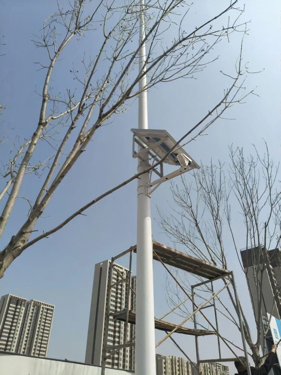 urban road surveillance solar camera power system in Beijing China demonstrates that autonomous off-grid solar storage architecture maintains continuous monitoring operation under grid-access limits, seasonal temperature variation, windblown dust, rain, snow, haze, and low-impact installation constraints