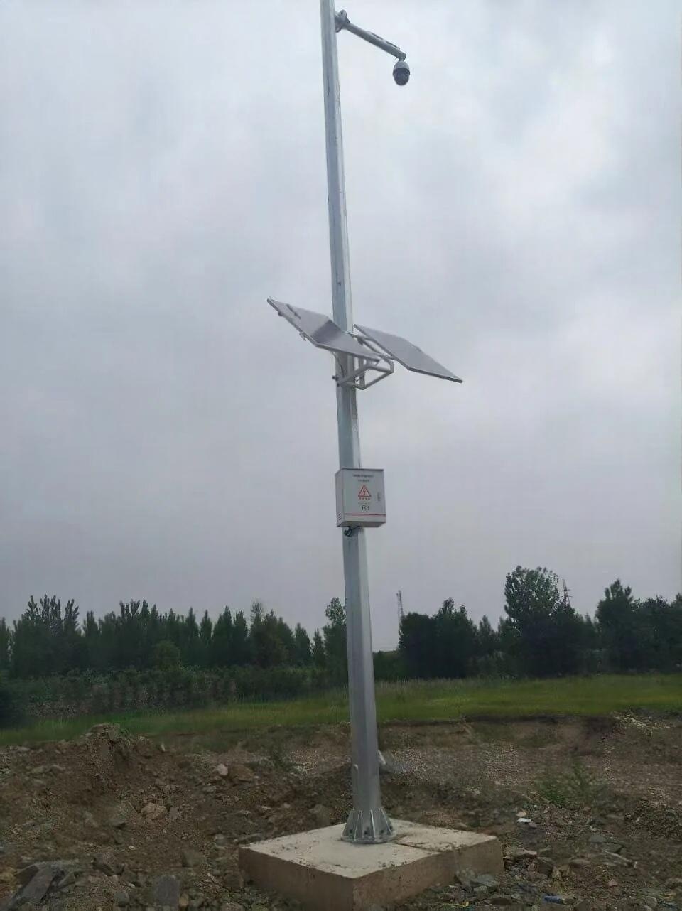 Concrete-mounted solar surveillance pole in remote waterway infrastructure confirms that stable foundations, protected equipment placement, and suitable photovoltaic positioning support long-term monitoring under exposed terrain, installation constraints, wind loading, and limited maintenance access